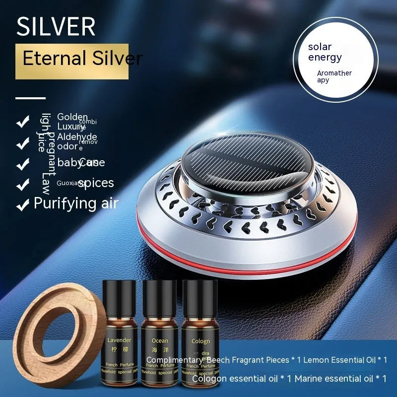 Solar-powered aluminium alloy car air freshener diffuser in black colour on a car dashboard.
