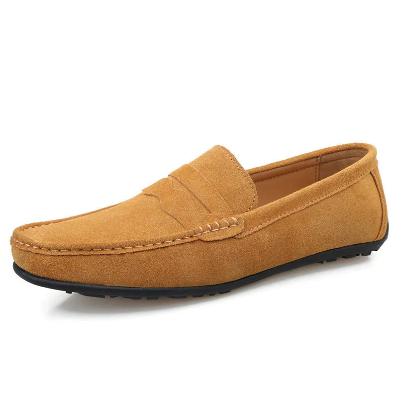 Men's suede slip-on loafers in a solid colour with a round toe and flat rubber sole.