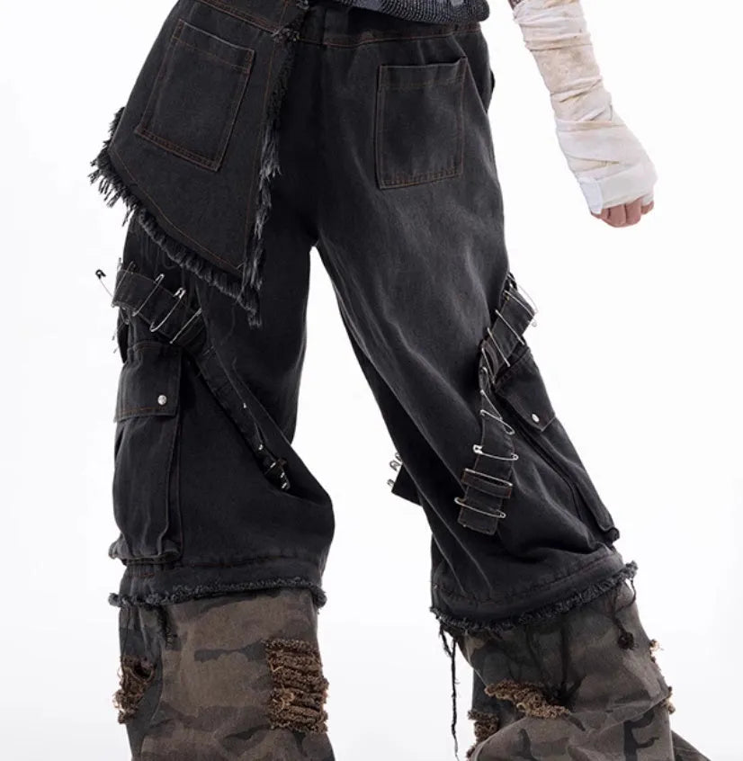Men's grey and camouflage colour-block jeans with a structured pin and ribbon detail.