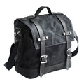 Black waterproof canvas motorcycle side pannier bag with leather trim mounted on a bike