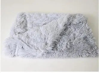 Long plush pet blanket in wool polyester blend showing dark grey, light grey and white colour options with size comparison