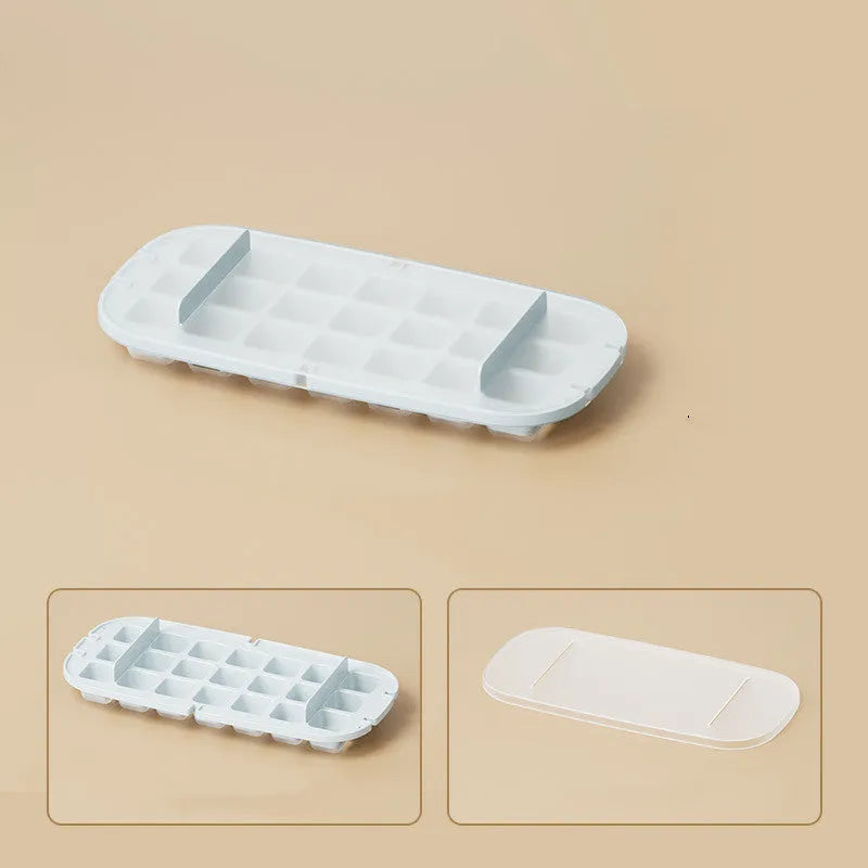 Yellow lever-operated ice cube tray grid with high capacity design and stored ice shovel.
