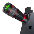 20x mobile phone telescope lens with universal mounting clip and single eye mask on a white background.