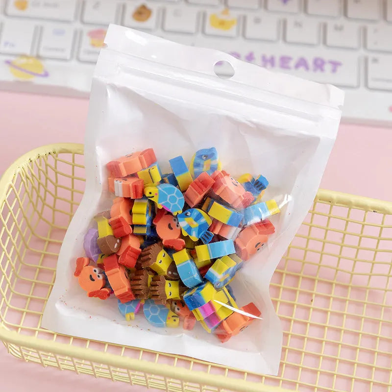50 colourful cartoon mini erasers in shapes of fruits, animals, and cakes, displayed next to a pearlescent film bag.