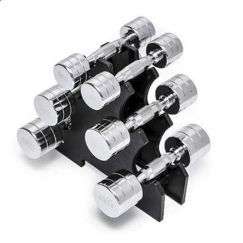 Silver electroplated steel dumbbell with hexagonal handle on a gym floor