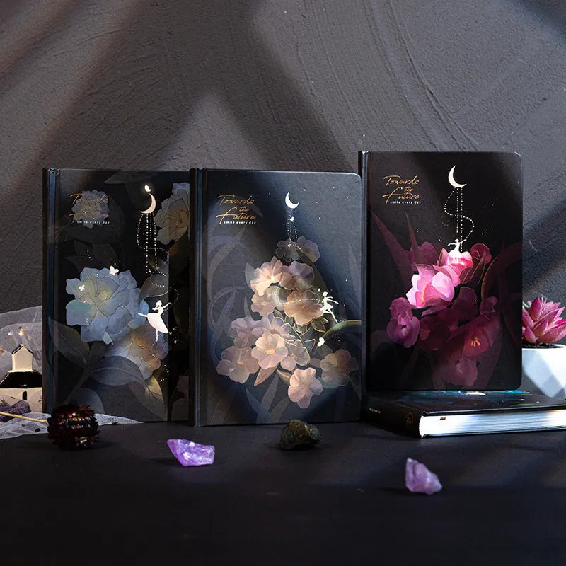A5 spiral-bound notebook with a luminous holographic cover showing colour illustrations on the open pages.