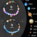 Two natural stone beaded bracelets with metal zodiac charm pendants on a flat surface.