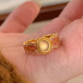 Pink crystal enamel open ring with geometric shape and gold plating on copper