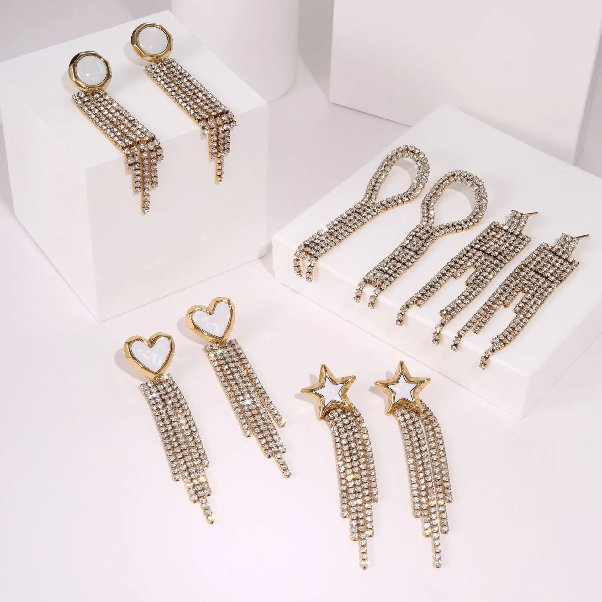 Women's stainless steel earrings with gold plated heart and star shapes in an irregular geometric design.