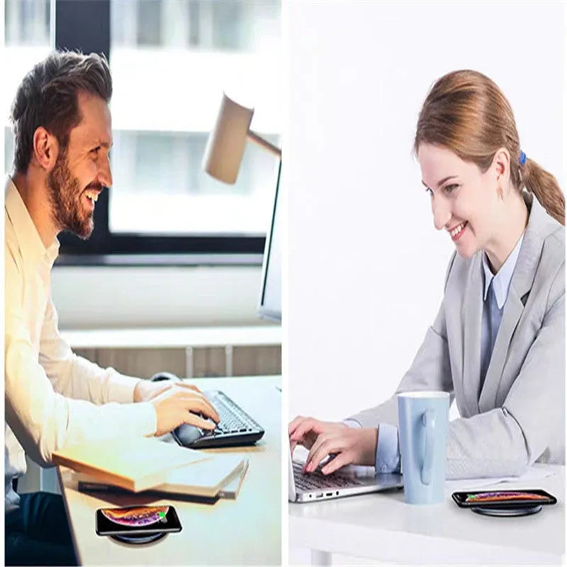 Black aluminium alloy Qi wireless fast charging pad for phones on a wooden desk.