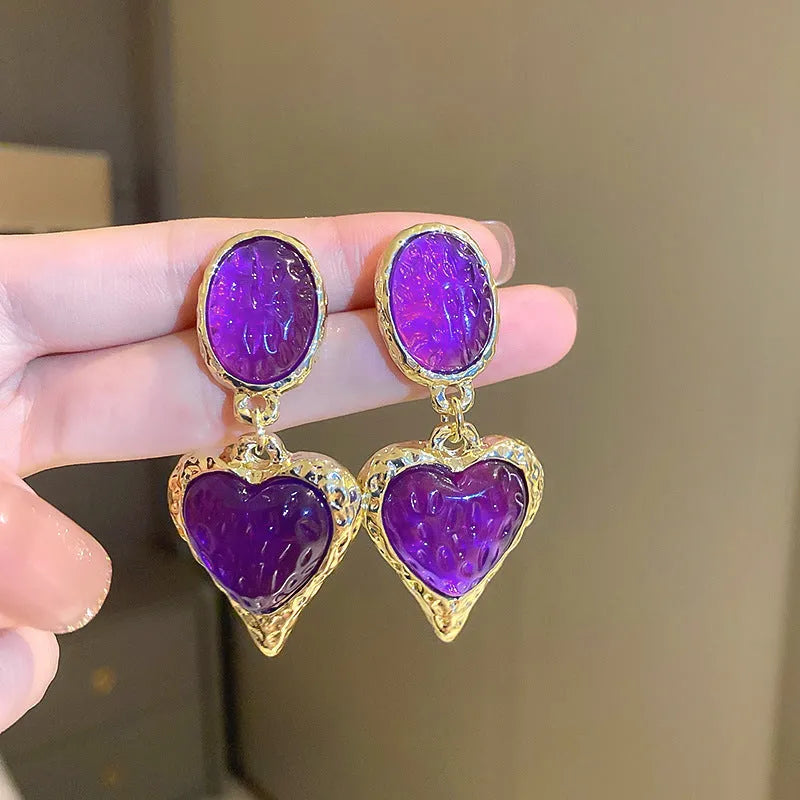 Silver needle pleated oval love heart stud earrings in alloy, showing green, purple, red, and yellow and white colour options.
