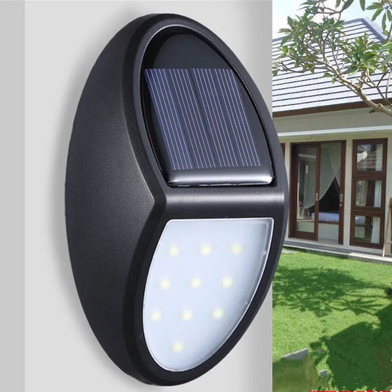 Black rectangular solar-powered LED wall light with automatic sensor for outdoor use.
