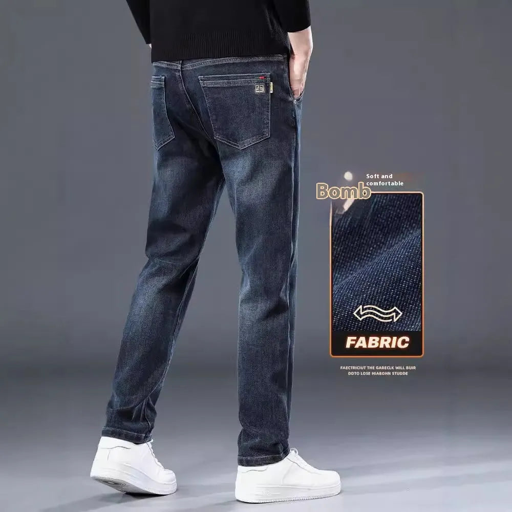 Blue grey and black slim straight loose casual thin trousers on a hanger, showing mid waist and zipper fly.