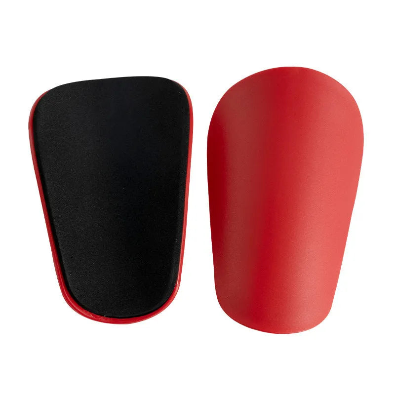 PU mini shin guards for football and sports in black, white, red, and blue colours.