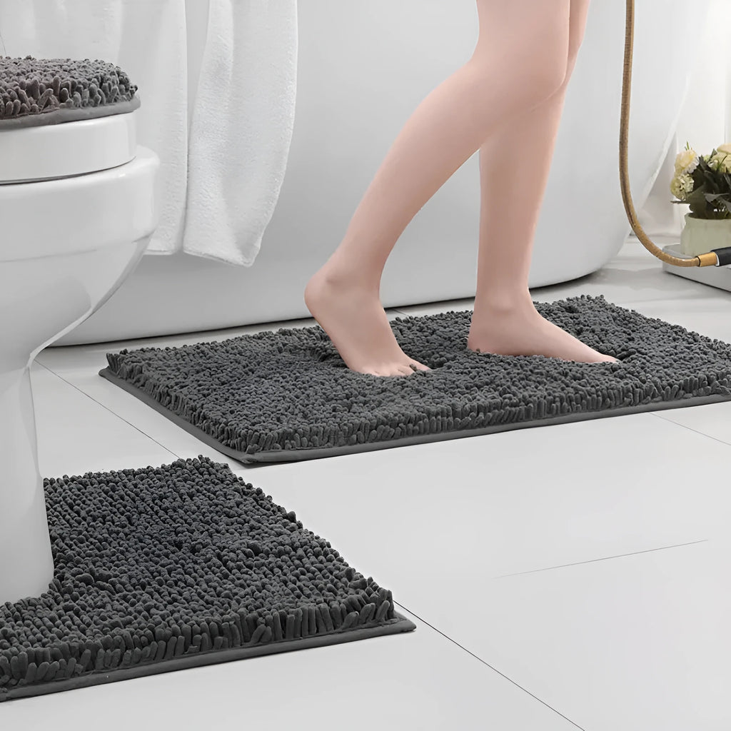 Chenille bathroom carpet three-piece set showing U-shaped toilet mat and two rectangular rugs in green.