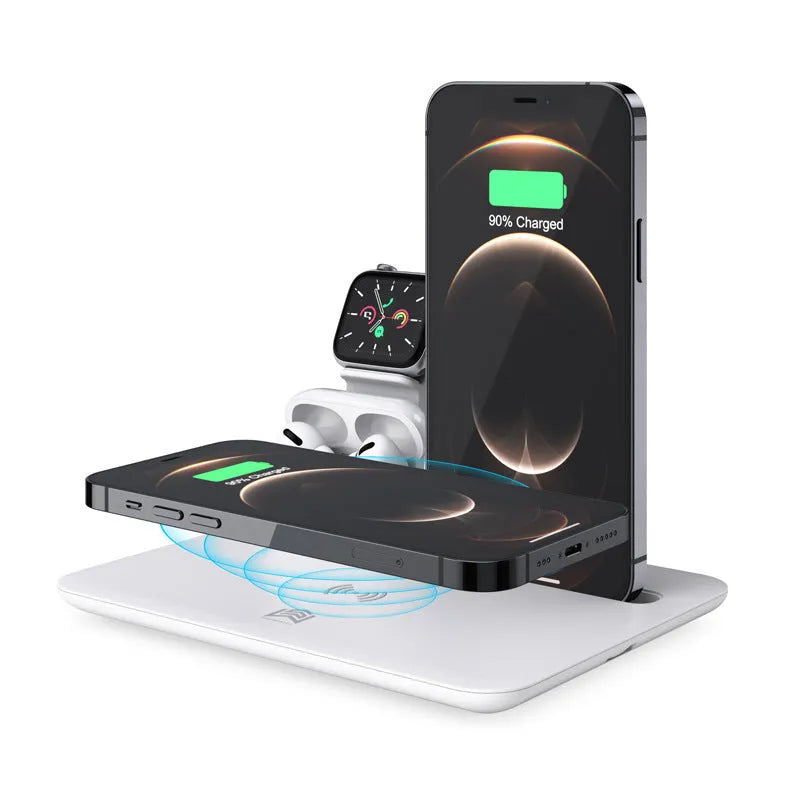 Black and white wireless desktop charging station for phone, headphones and watch on a desk