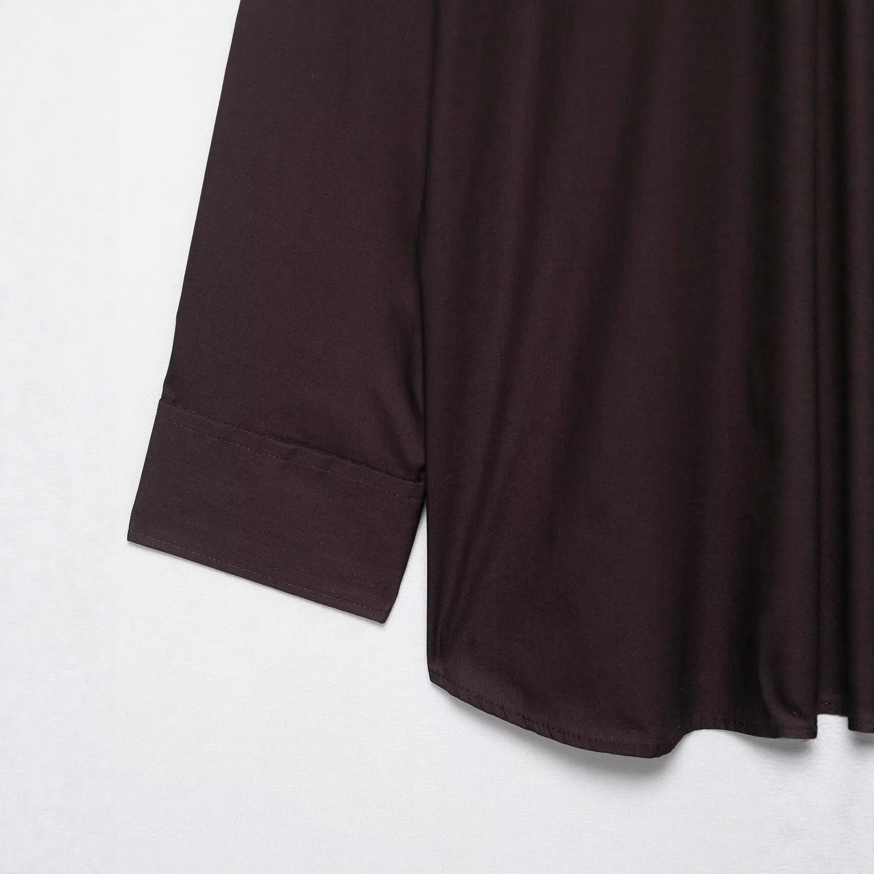 Brown women's poplin shirt with a bow tie, cardigan-style front, and long sleeves.
