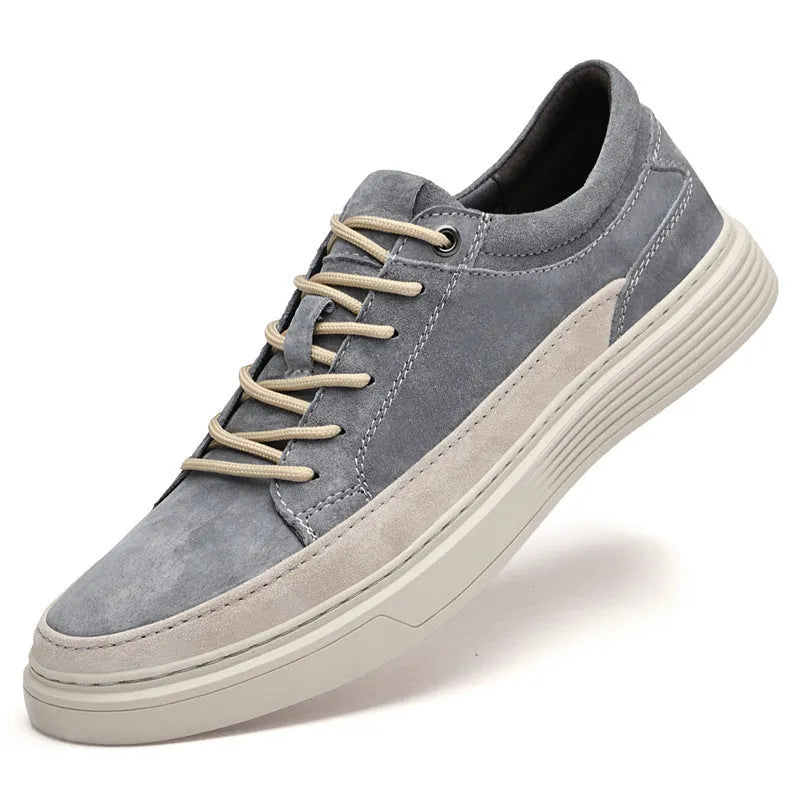 Men's grey casual skate shoes with pigskin upper and rubber sole on a white background