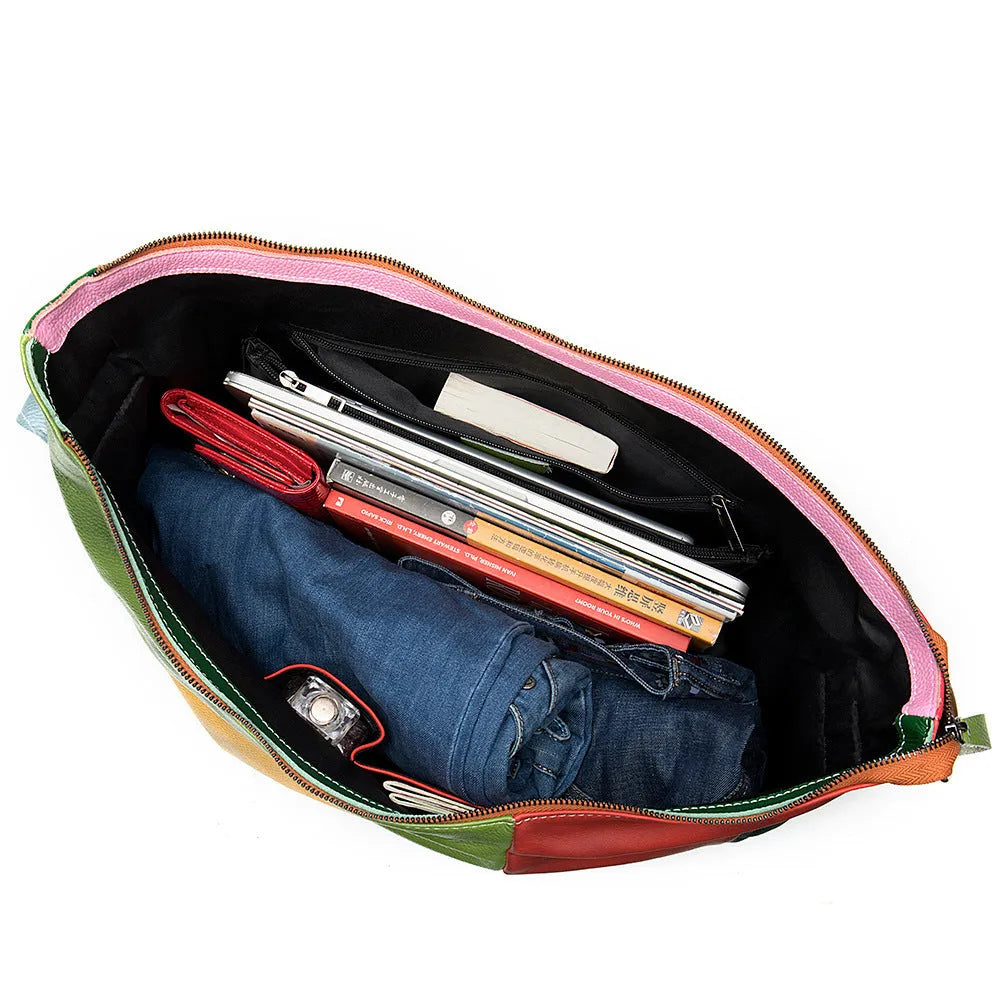 Cowhide leather crossbody travel bag in picture colour, shown with shoulder strap