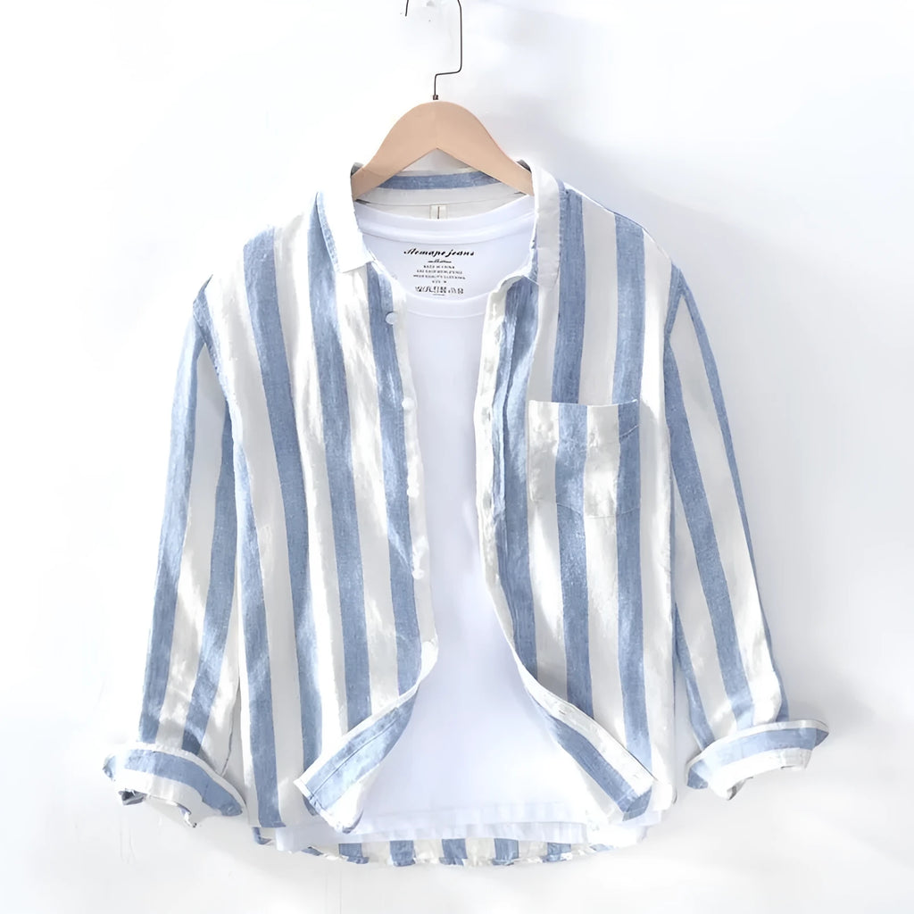 Men's loose fit blue long sleeve Hong Kong style shirt with fleece lining on a hanger.