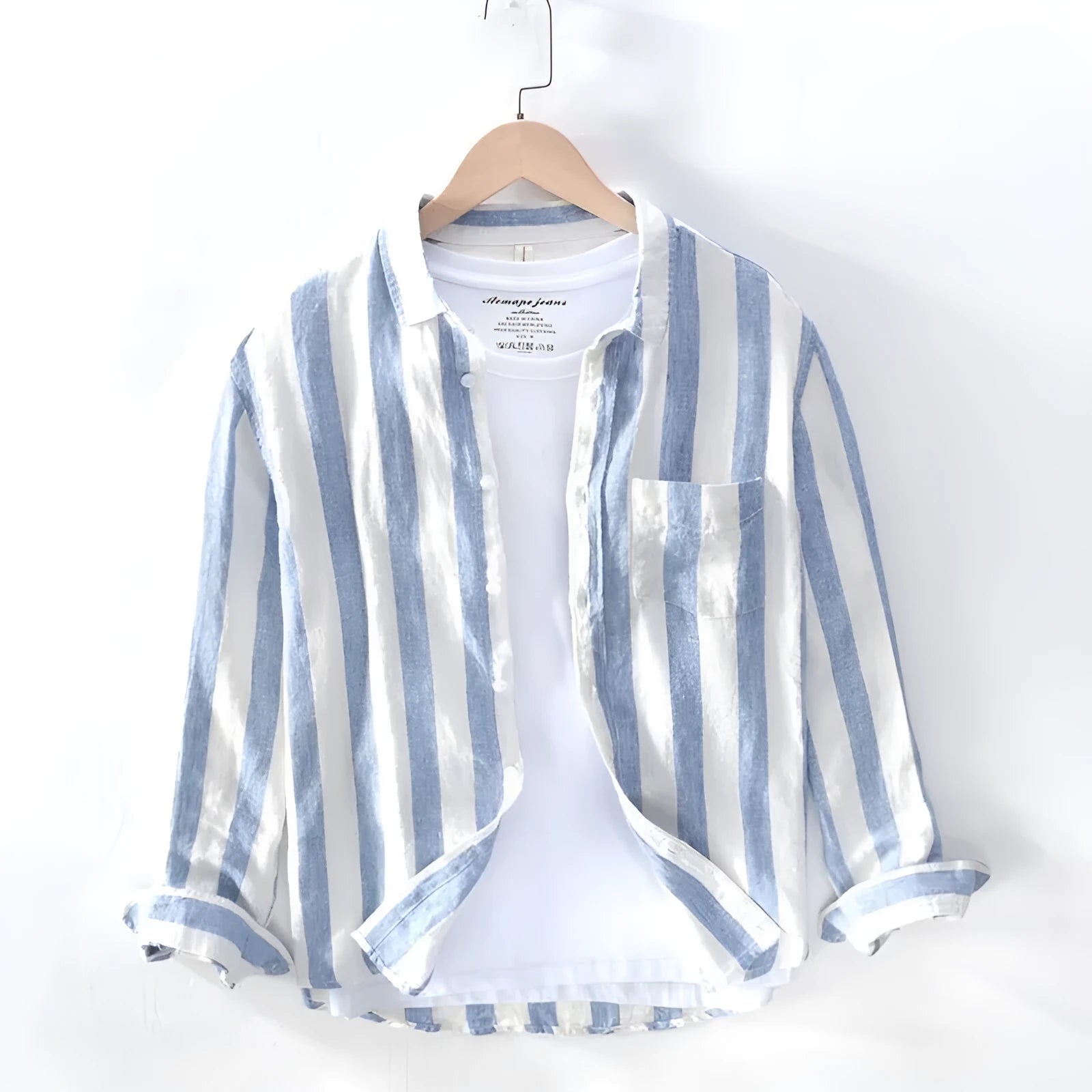 Men's loose fit blue long sleeve Hong Kong style shirt with fleece lining on a hanger.