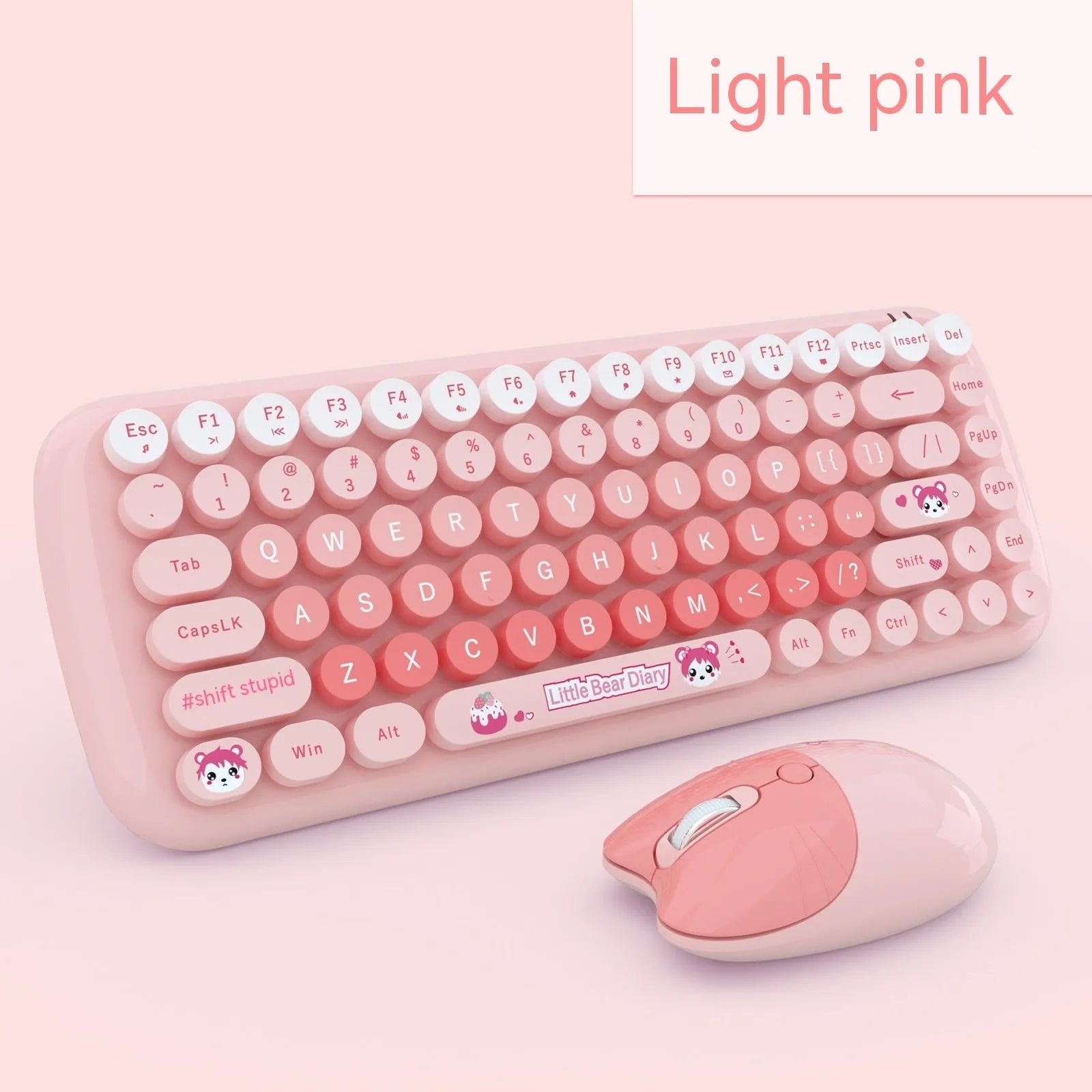 Pink mini wireless keyboard and mouse set with compact design on a desk