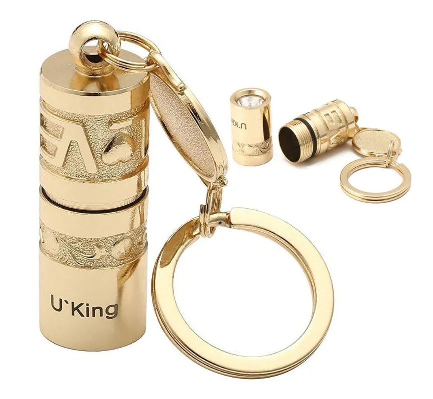 Gold zinc alloy waterproof LED flashlight attached to a keychain.
