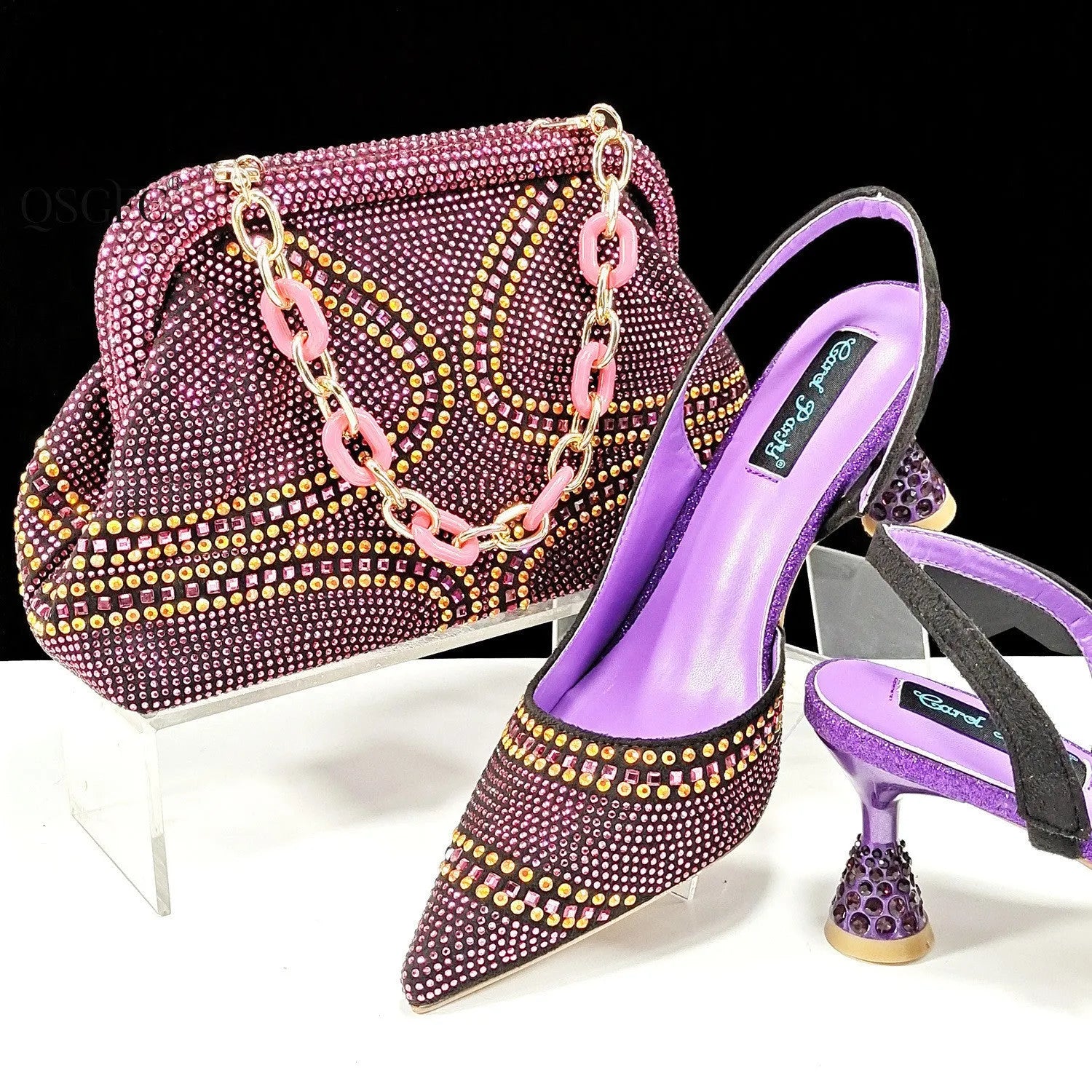 Women's pointed-toe high heel shoes with matching bag, featuring a stiletto heel and rhinestone detail on a synthetic leather upper.