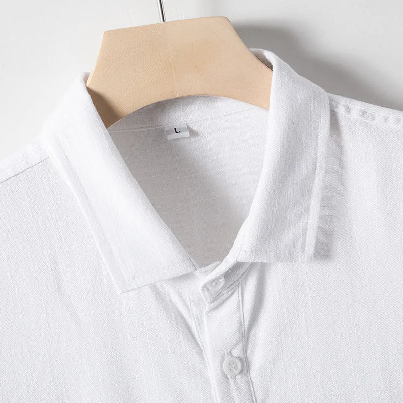 Men's loose-fit linen-blend T-shirt with a lapel collar in black, shown on a hanger.