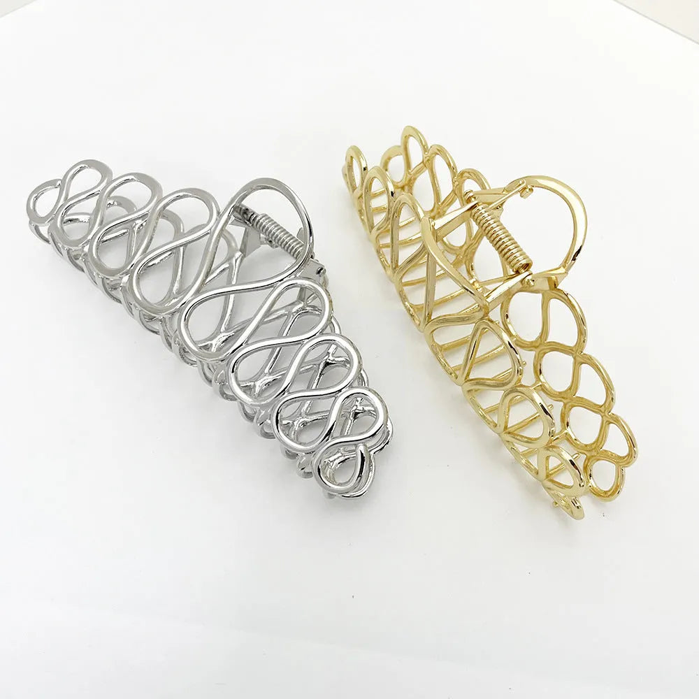 Large alloy hair clip with gold electroplated finish and irregular tassel detail