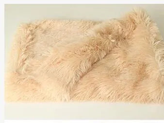 Long plush pet blanket in wool polyester blend showing dark grey, light grey and white colour options with size comparison