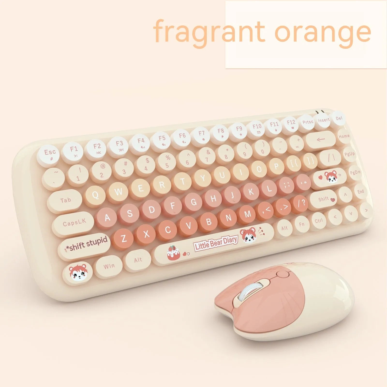 Pink mini wireless keyboard and mouse set with compact design on a desk
