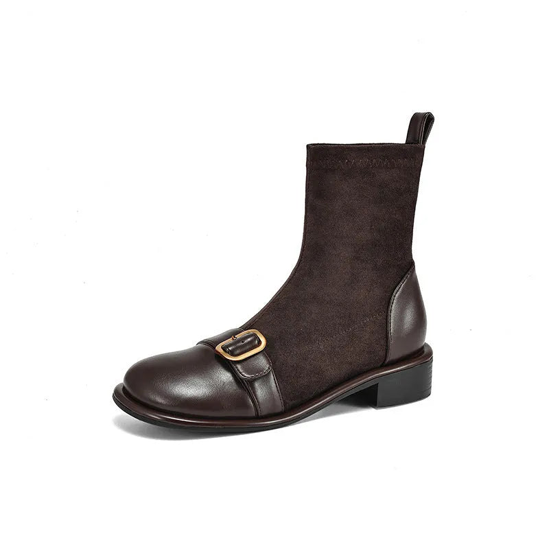 Black women's low heel Martin ankle boots with front lace-up and metal buckle detail on a white background.