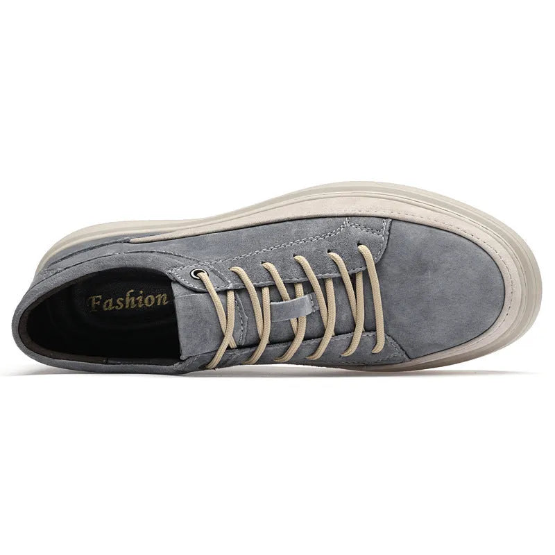 Men's grey casual skate shoes with pigskin upper and rubber sole on a white background
