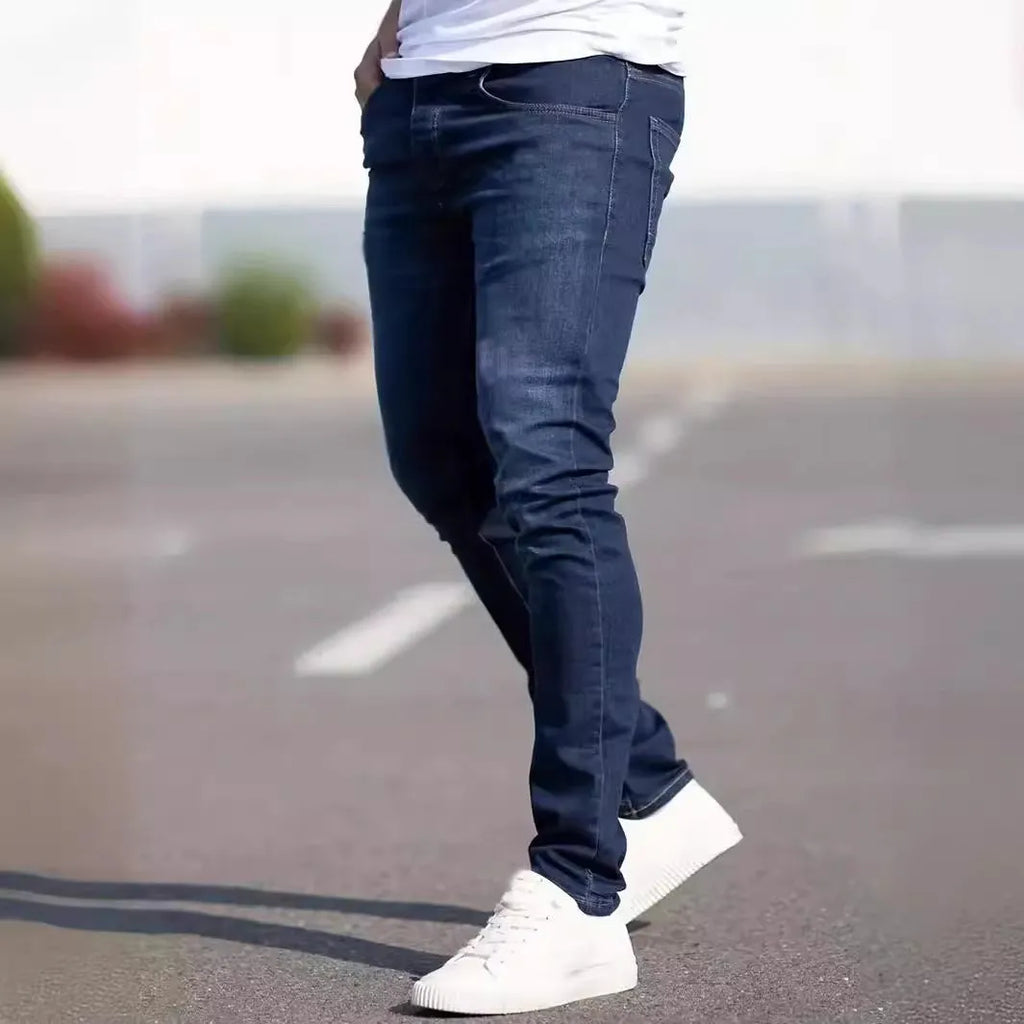 Men's slim fit dark blue jeans with skinny leg design and mid waist cut