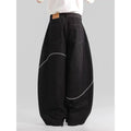 Black straight-leg denim trousers for teenagers on a hanger, showing mid-waist and zip fly detail.