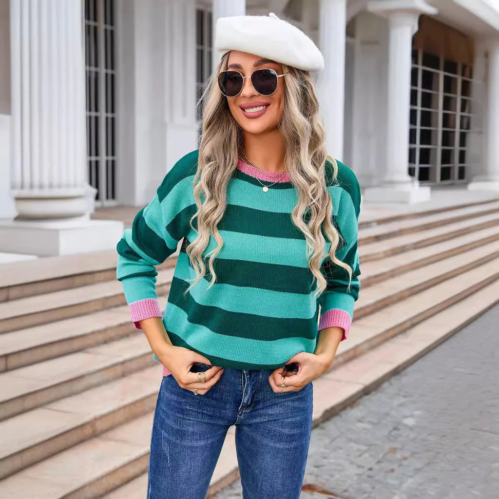 Women's loose blue acrylic long sleeve sweater with round neck on hanger