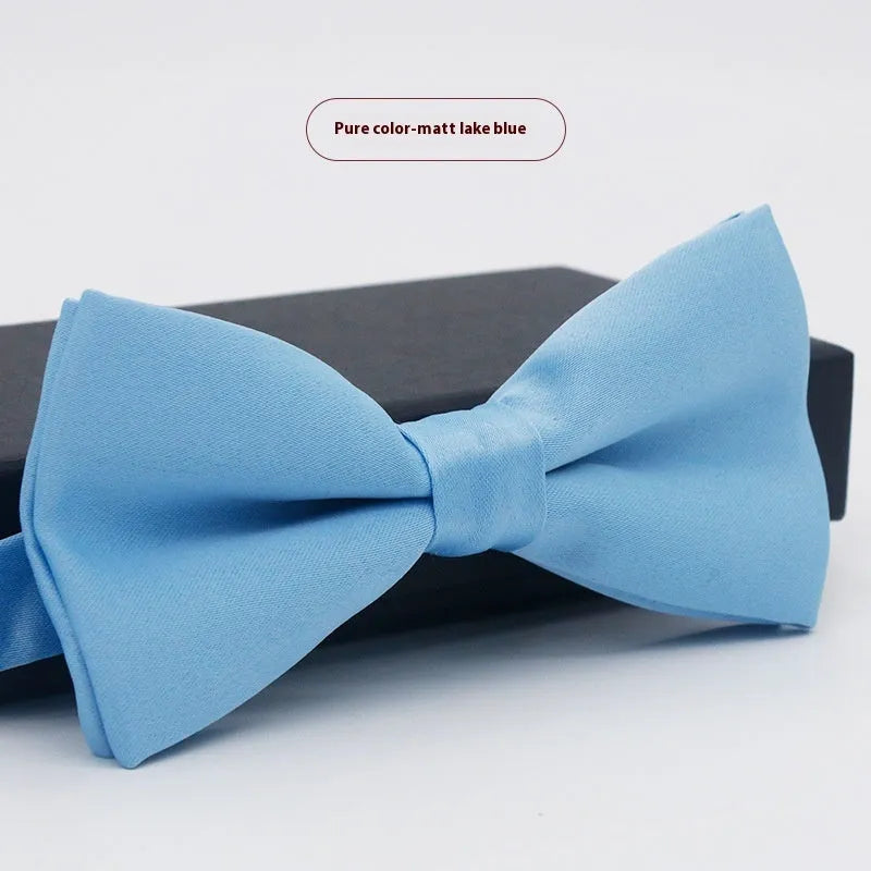 Men's flat head solid colour bow tie in polyester, showing 12cm by 6cm size on a background.