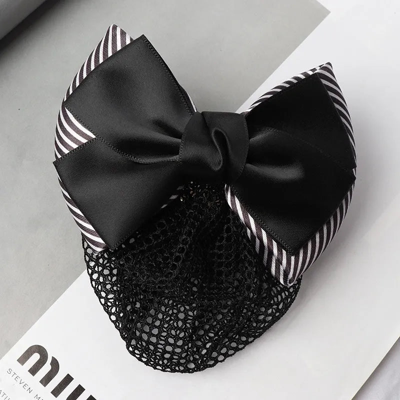Professional flower bow headdress hair clip ornament on a work plate, shown in a selection of net and mesh colour variations.