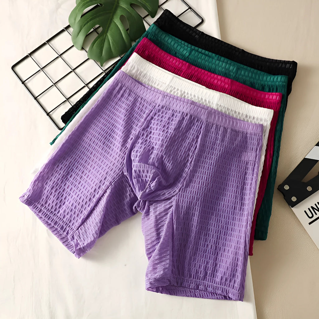 Men's lace boxer briefs in rose red colour showing shaping design on a mannequin.