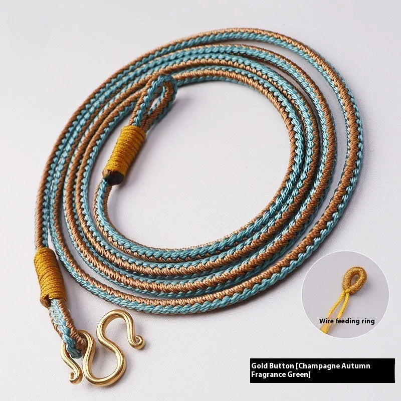 Gold peace buckle choker necklace with intricate mixed gemstone inlaid pendant on a model.