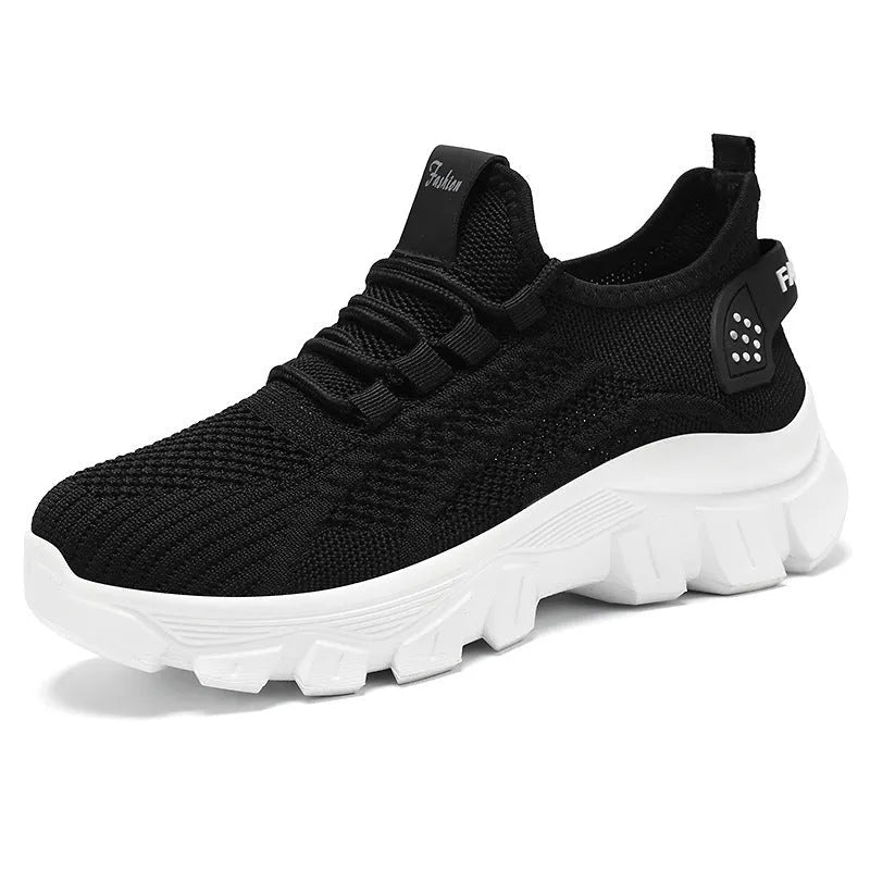 Men's white Flyknit lace-up running sneakers with a thick PVC sole on a plain background.