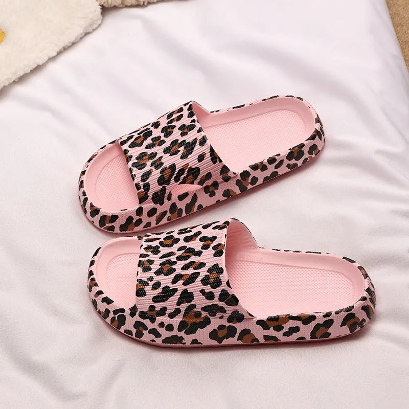 Women's leopard print EVA slippers with a thick sole on a plain background.