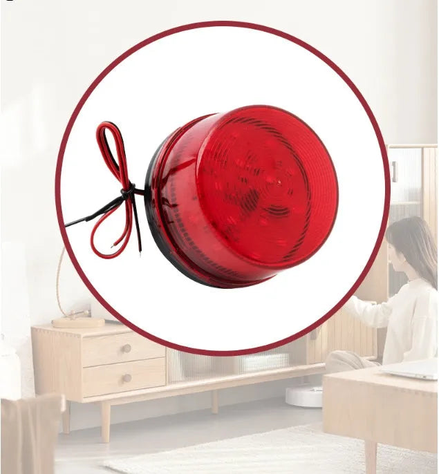 Small red 24V warning and alarm light with strobe flash and siren, model HC-79, on its mounting base.