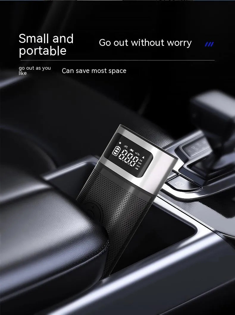 Black portable wireless smart vehicle air pump with USB-C cable and multiple nozzles on a grey background.