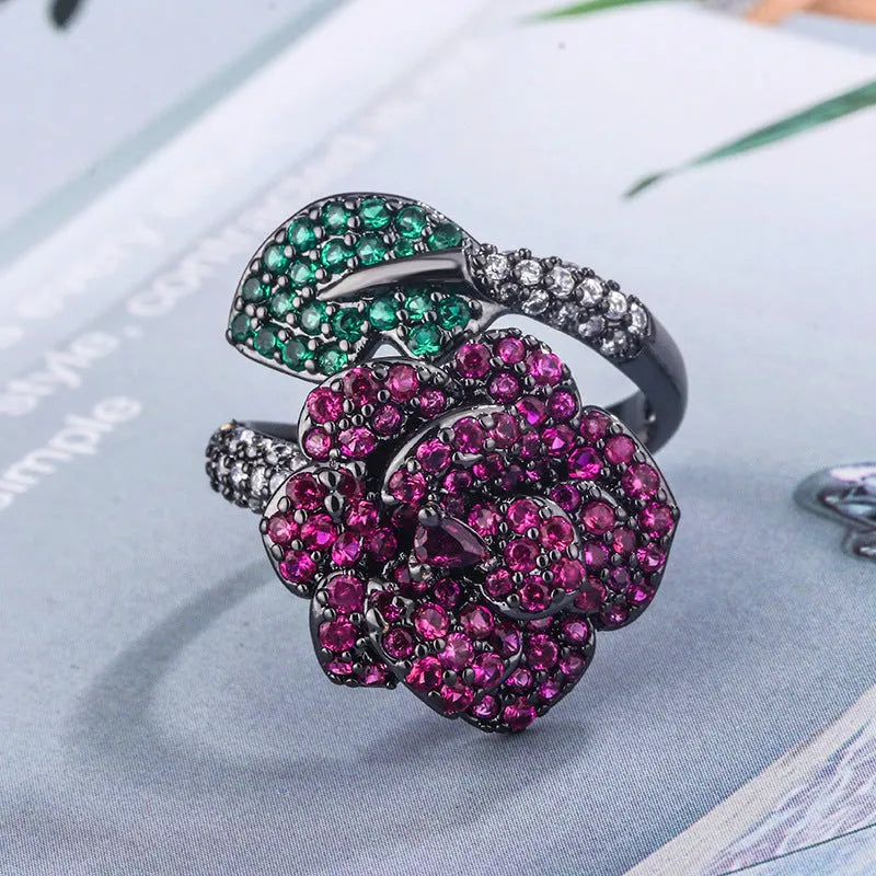 Geometric black gold women's ring with simulated red corundum stones