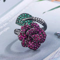 Geometric black gold women's ring with simulated red corundum stones