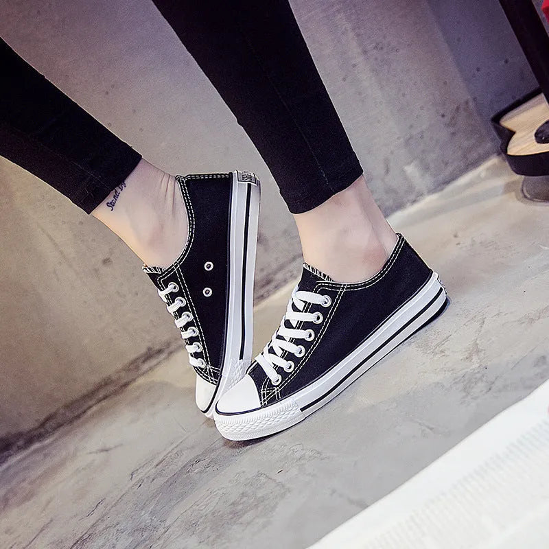 Solid colour women's casual canvas slip-on shoes on a white background, showing the simple design and canvas upper material.