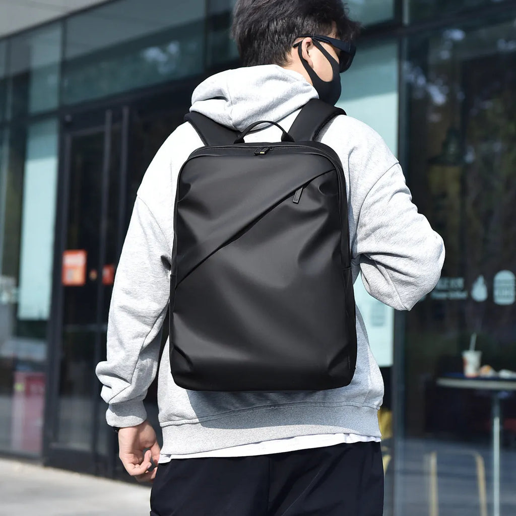 Waterproof black PU leather backpack with sewing thread details and large capacity storage