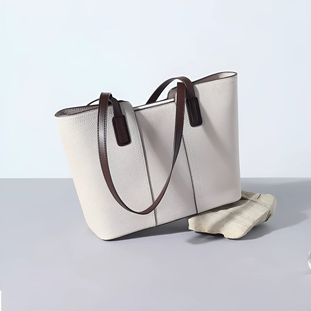 Women's genuine leather large capacity shoulder bag in khaki colour with visible sewing lines and a structured box shape.